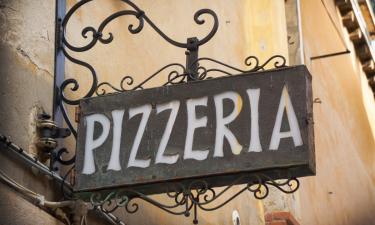 Pizzaria in Italy. Eating Pizza in Italy.